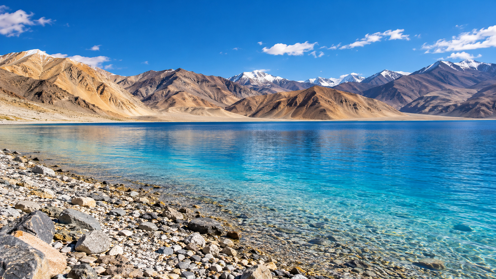 Illustration inspired by Pangong Lake in Ladakh, with turquoise water, a rocky shoreline and barren mountains.